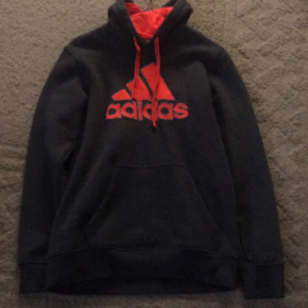 Grey and orange Adidas hoodie.